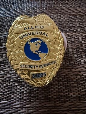 Allied Universal Security Services Badge Gold Blue.